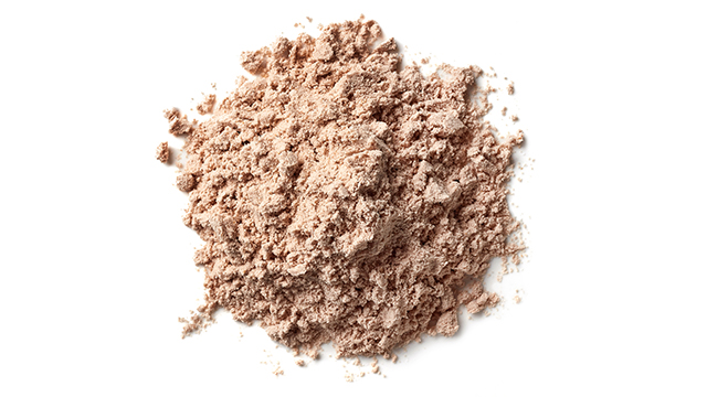 Heap of brown chocolate protein powder isolated on white background smaller